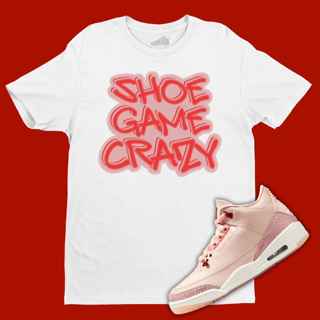 White 'Shoe Game Crazy' t-shirt designed to match the Air Jordan 3 Valentine's Day 2025, featuring bold typography and sneaker-inspired graphics.