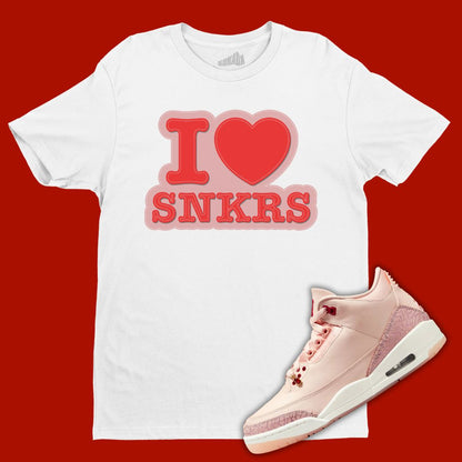 White 'I Love Sneakers' t-shirt designed to match the Air Jordan 3 Valentine's Day 2025, featuring bold typography and sneaker-inspired graphics.