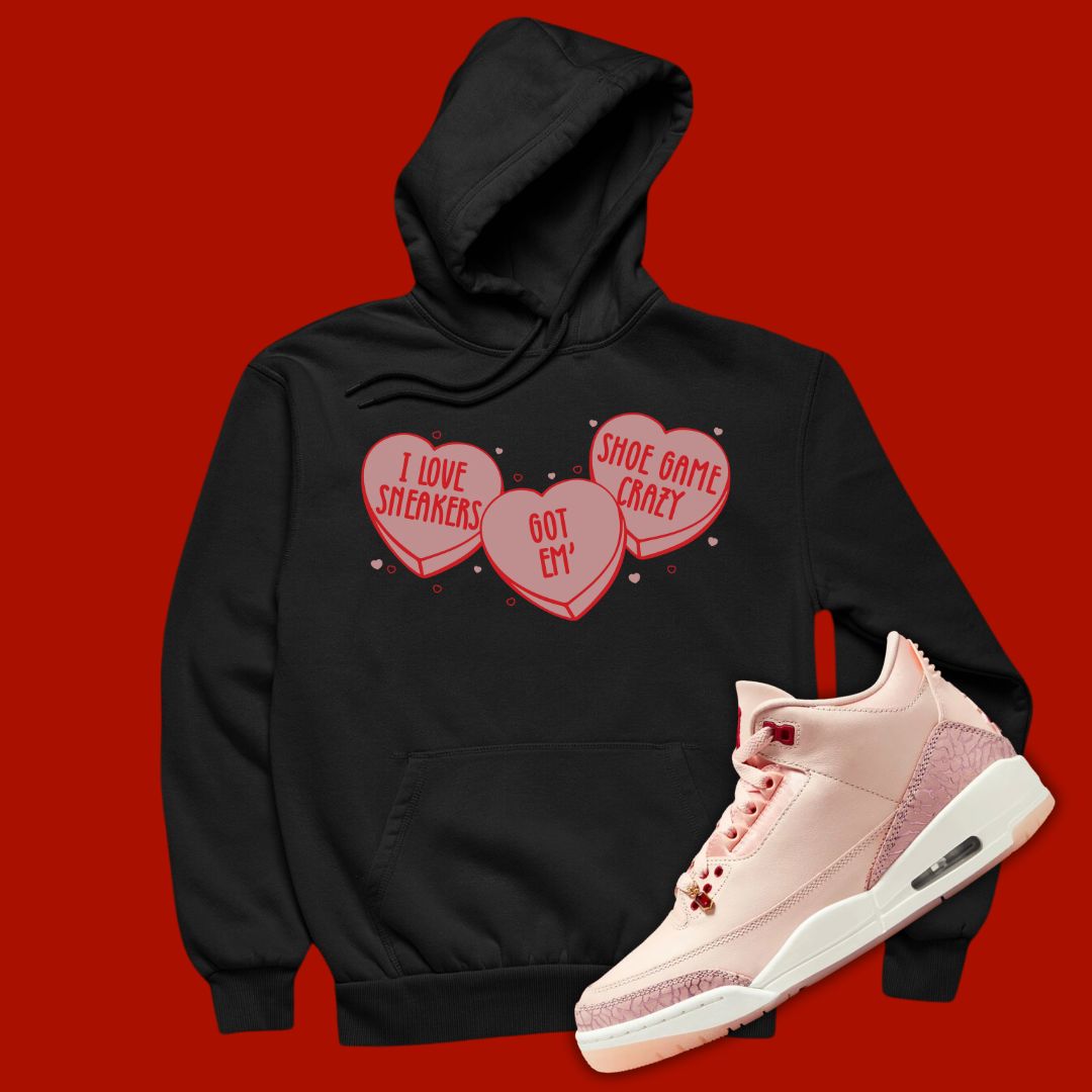 Black 'Candy Hearts' pullover hoodie designed to match the Air Jordan 3 Valentine's Day 2025, featuring bold typography and sneaker-inspired graphics.