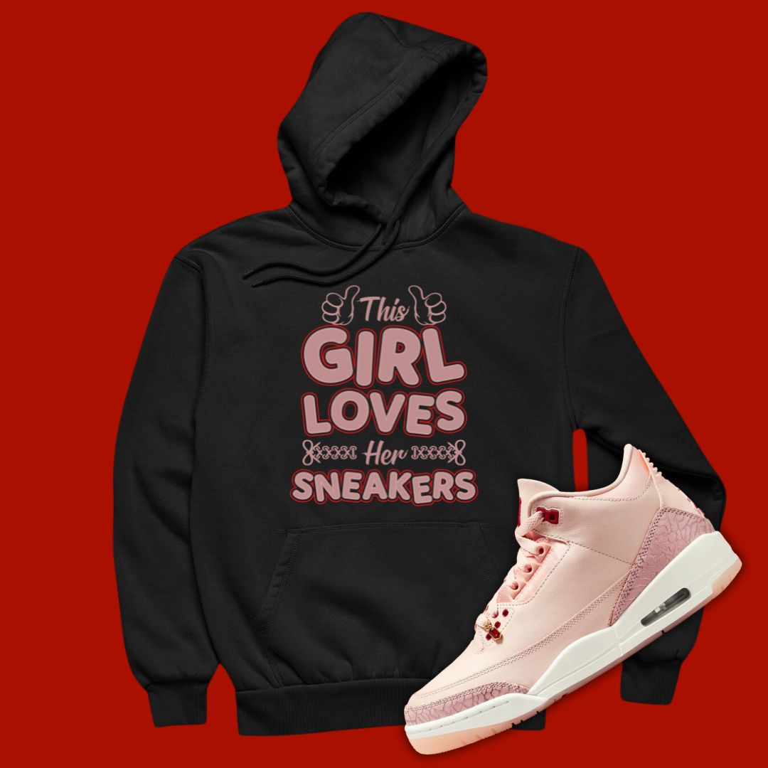 Black 'The Girl Loves Sneakers' hoodie designed to match the Air Jordan 3 Valentine's Day 2025, featuring bold typography and sneaker-inspired graphics.