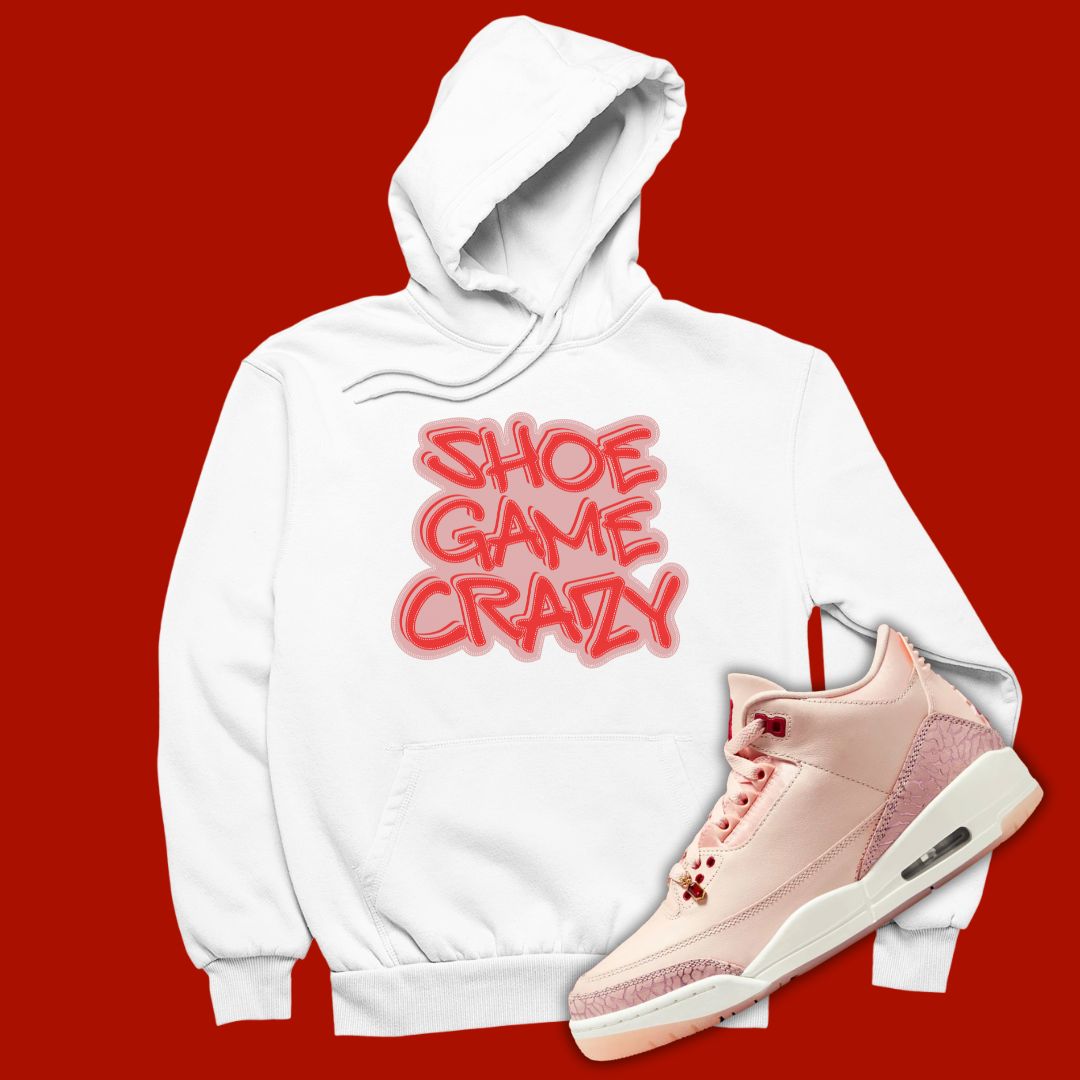 White 'Shoe Game Crazy' hoodie designed to match the Air Jordan 3 Valentine's Day 2025, featuring bold typography and sneaker-inspired graphics.