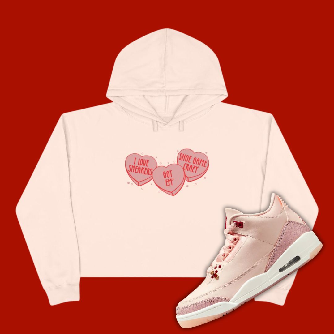 Pink 'Candy Heart' cropped hoodie designed to match the Air Jordan 3 Valentine's Day 2025, featuring bold typography and sneaker-inspired graphics.