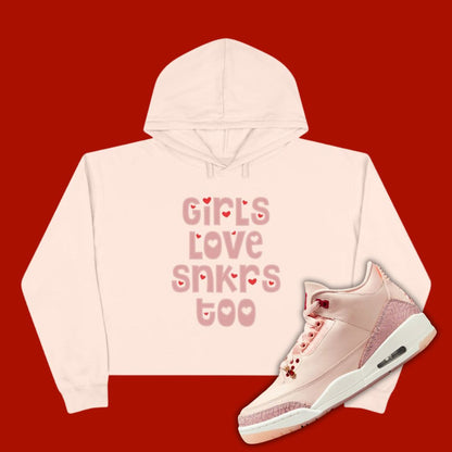 Pink 'Girls Love Sneakers Too' cropped hoodie designed to match the Air Jordan 3 Valentine's Day 2025, featuring bold typography and sneaker-inspired graphics.